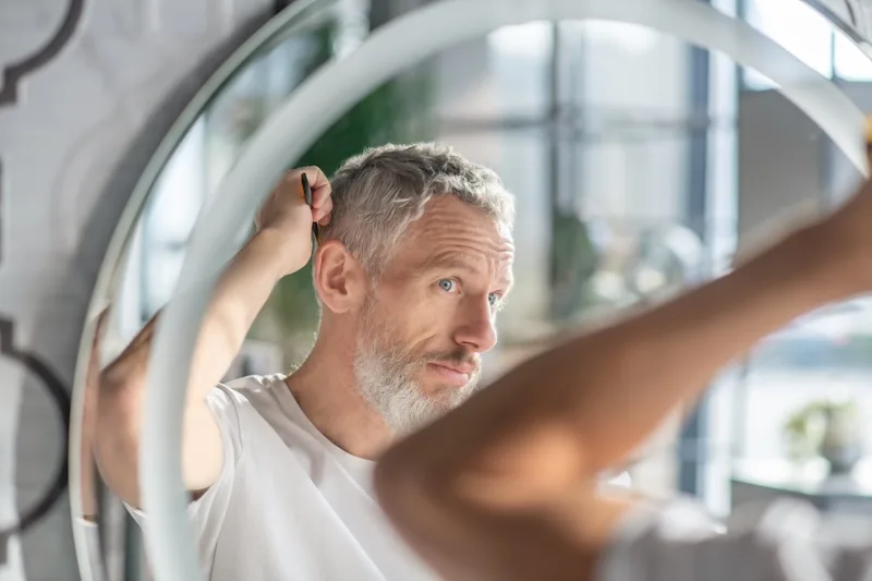 Person at home, candid moment relevant to a hair loss review
