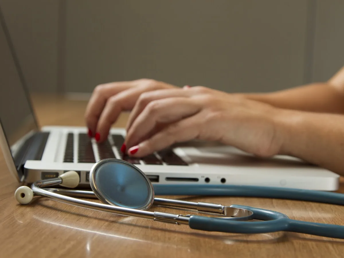 Doctor reviewing a patient request at their desk